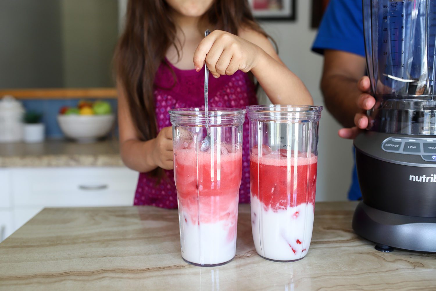 mixing coconut milk and strawberry juice