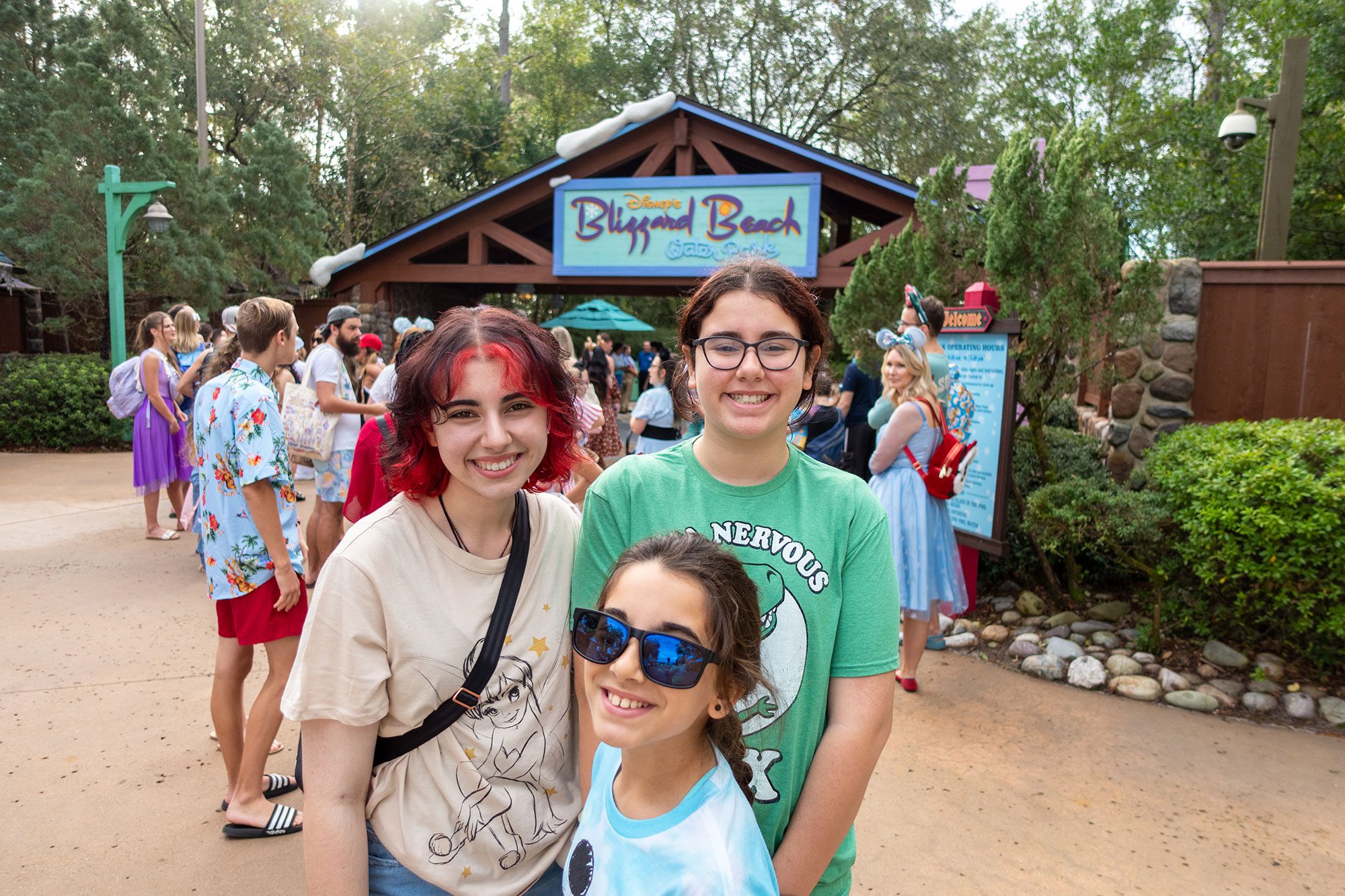 three sisters standing outside of the gate to Blizzard Beach